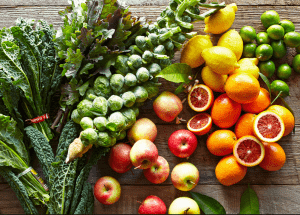 a group of fruits and vegetables on a wood surface Healthy Weight Loss Diets Brentford