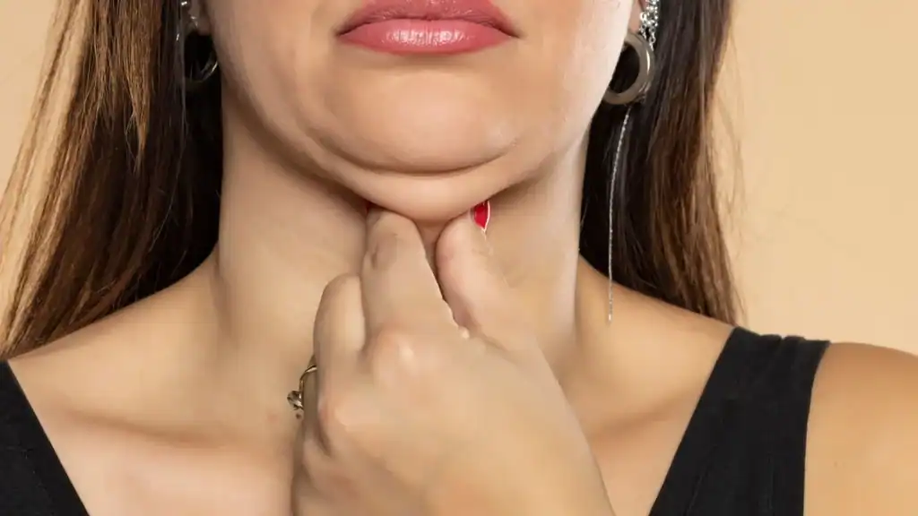 An image of a woman with double chin, sad, worried : Non Surgical Double Chin Removal Treatment in Brentford, UK